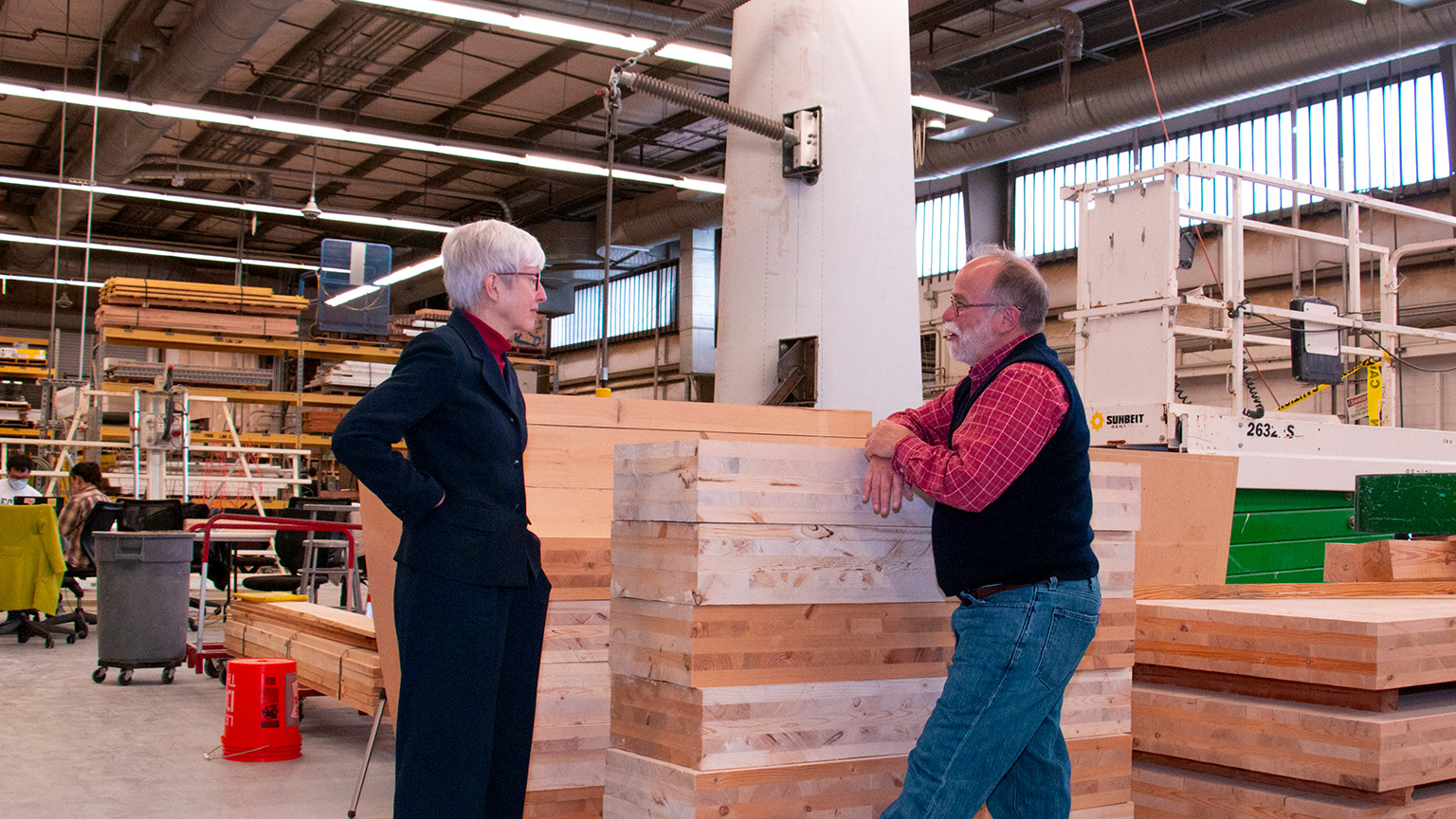 Valerie Thomas and Russell Gentry in front of mass timber components